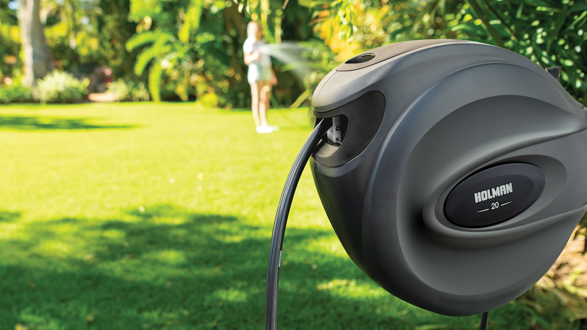 charcoal 20m retractable hose reel set up in backyard