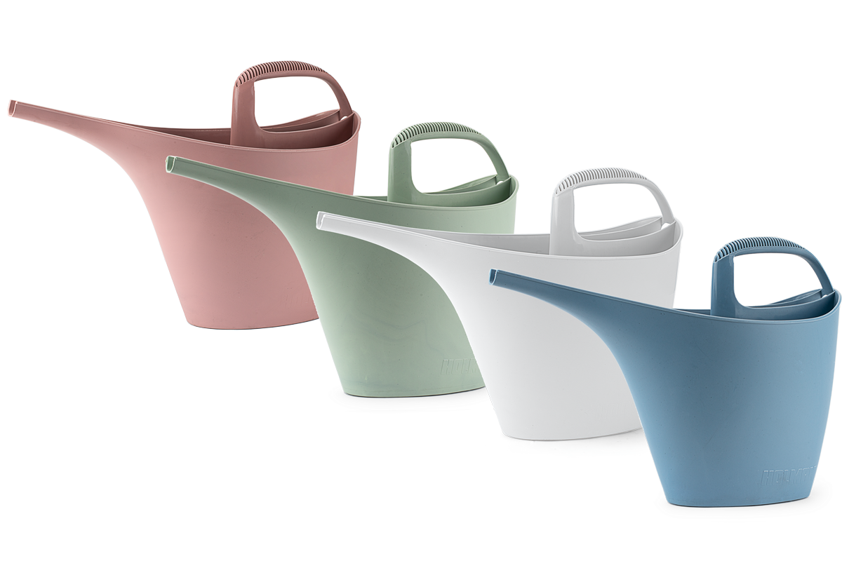 Range of ECO watering cans in colour ways of papaya pink, sage green, frost white, and asphalt blue